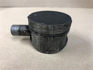 Badly worn piston (due to lack of lubrication)